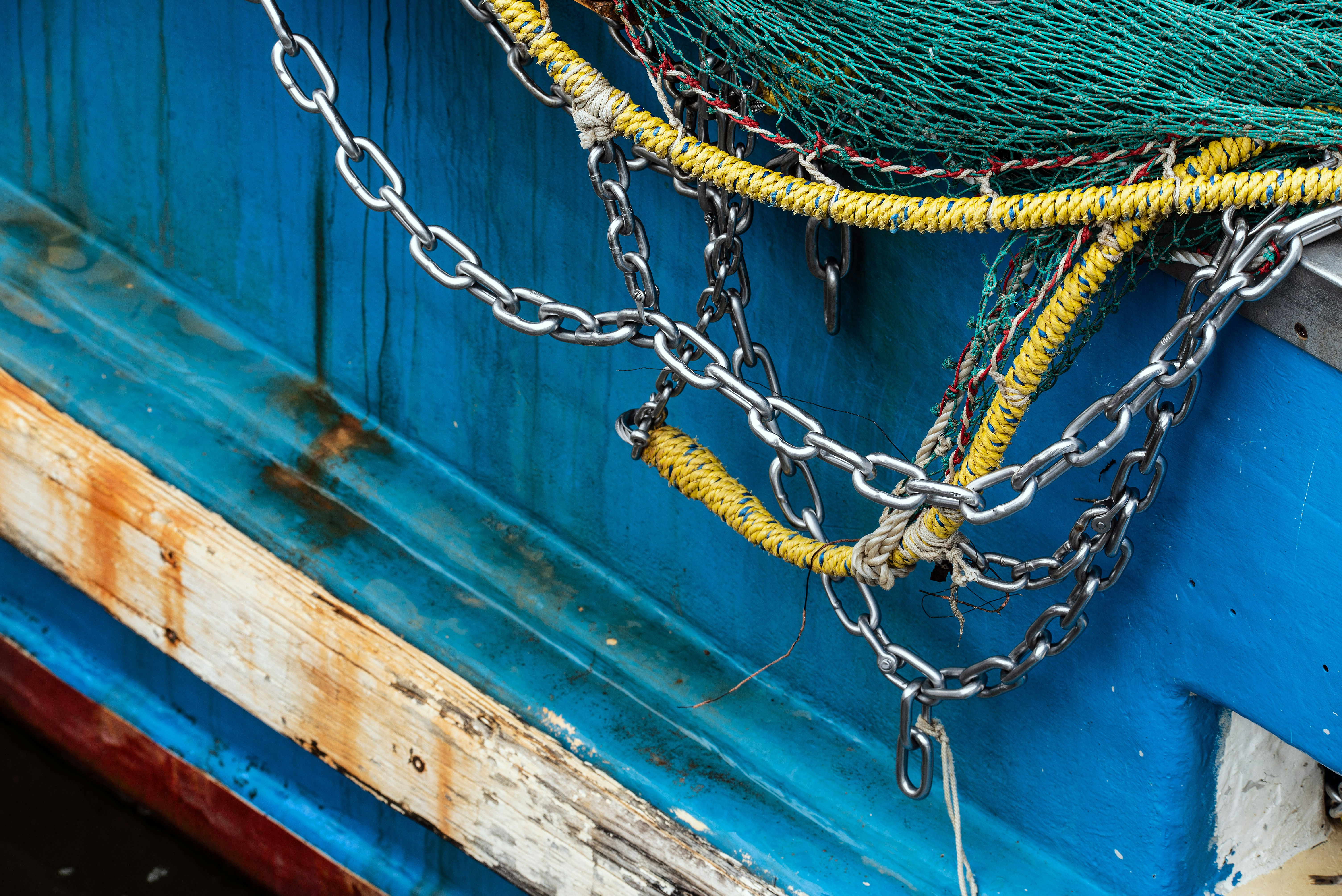 yellow and green rope on blue wooden door